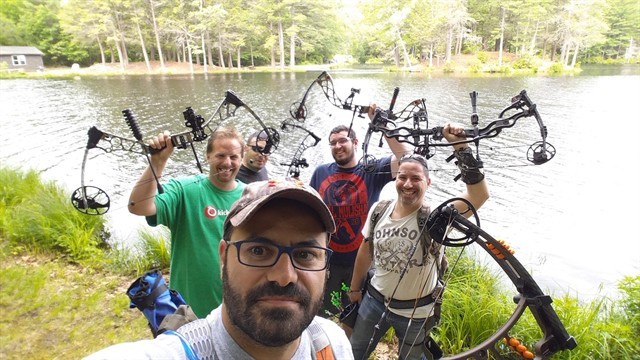 archers next to body of water photo