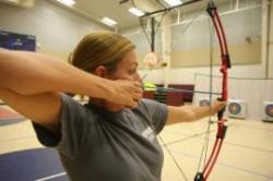 Female archer aiming a shot
